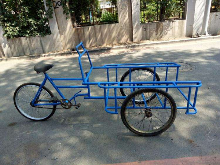 为什么东北的三轮车是倒着骑的