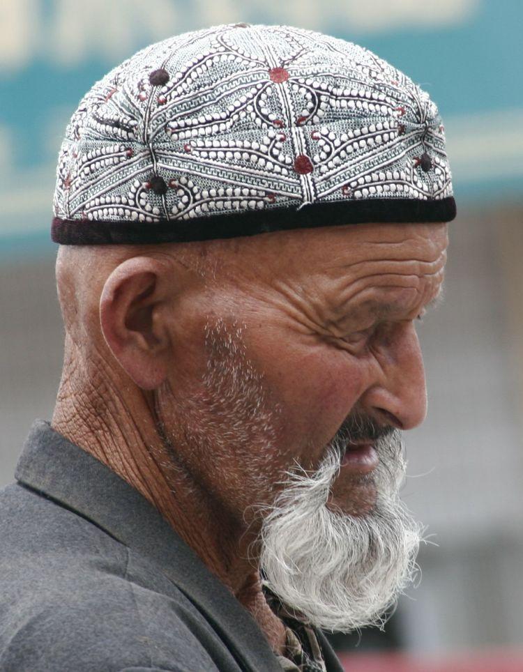 新疆帽子的正确戴法图片
